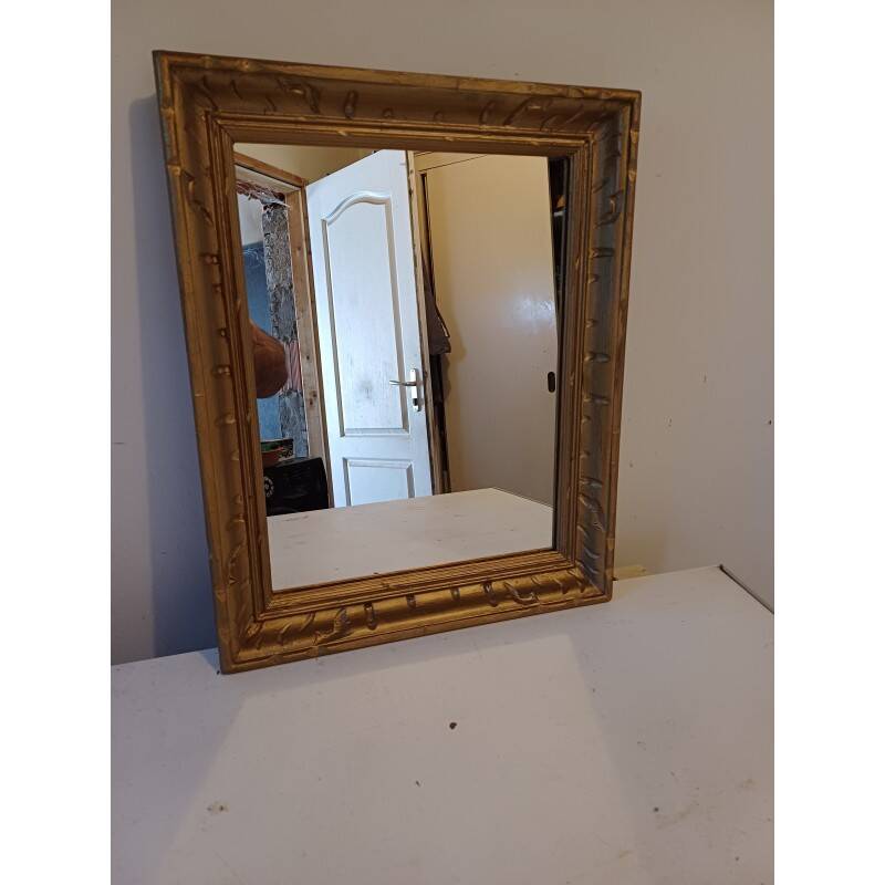 Wooden mirror and gold trim