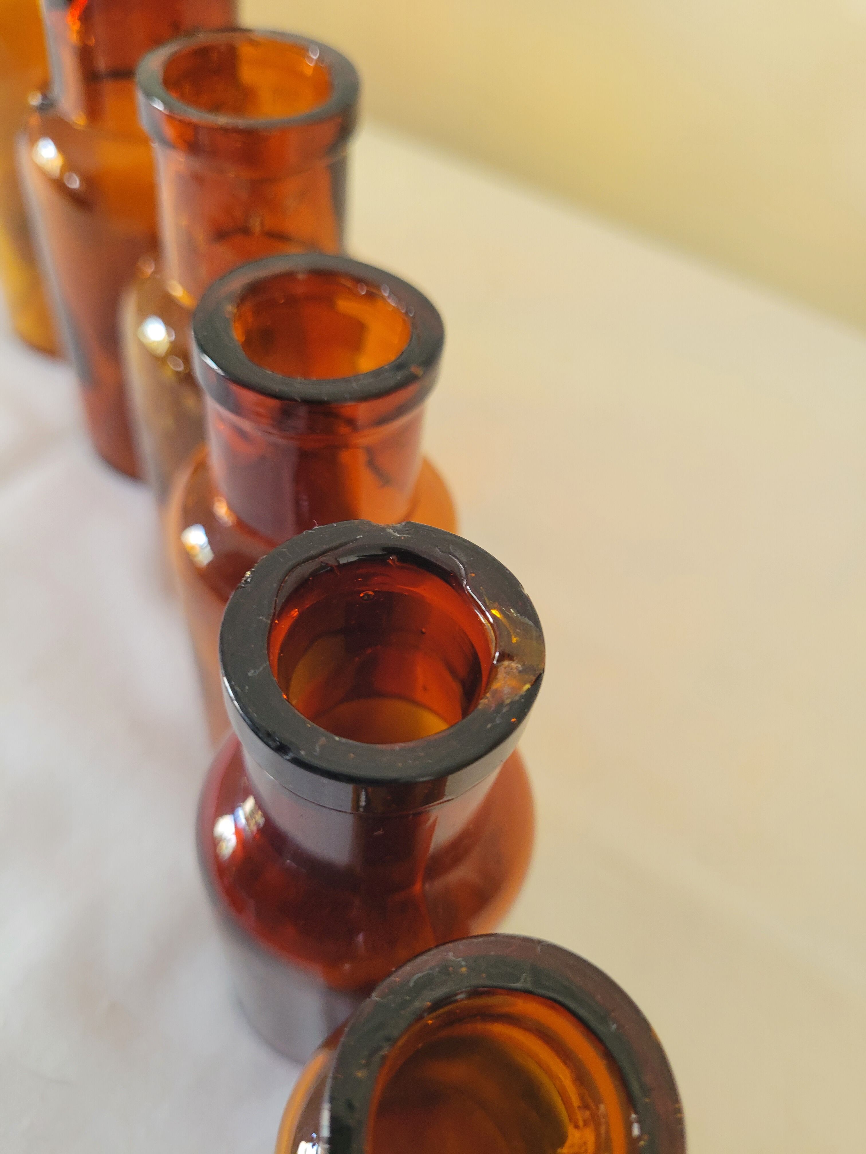 11 bottles of amber glass apothecary