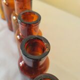11 bottles of amber glass apothecary