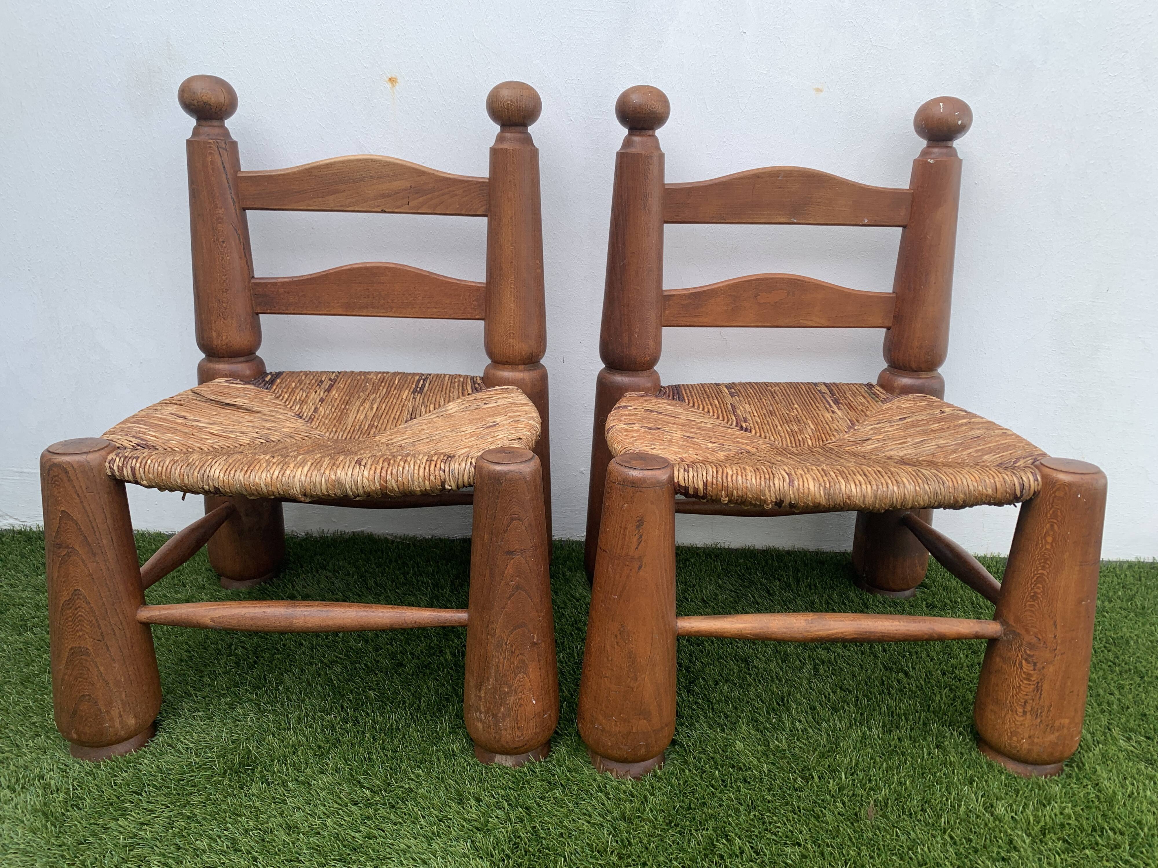 Pair of antique low fire chairs made of wood and straw