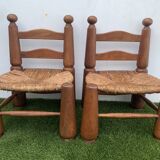 Pair of antique low fire chairs made of wood and straw