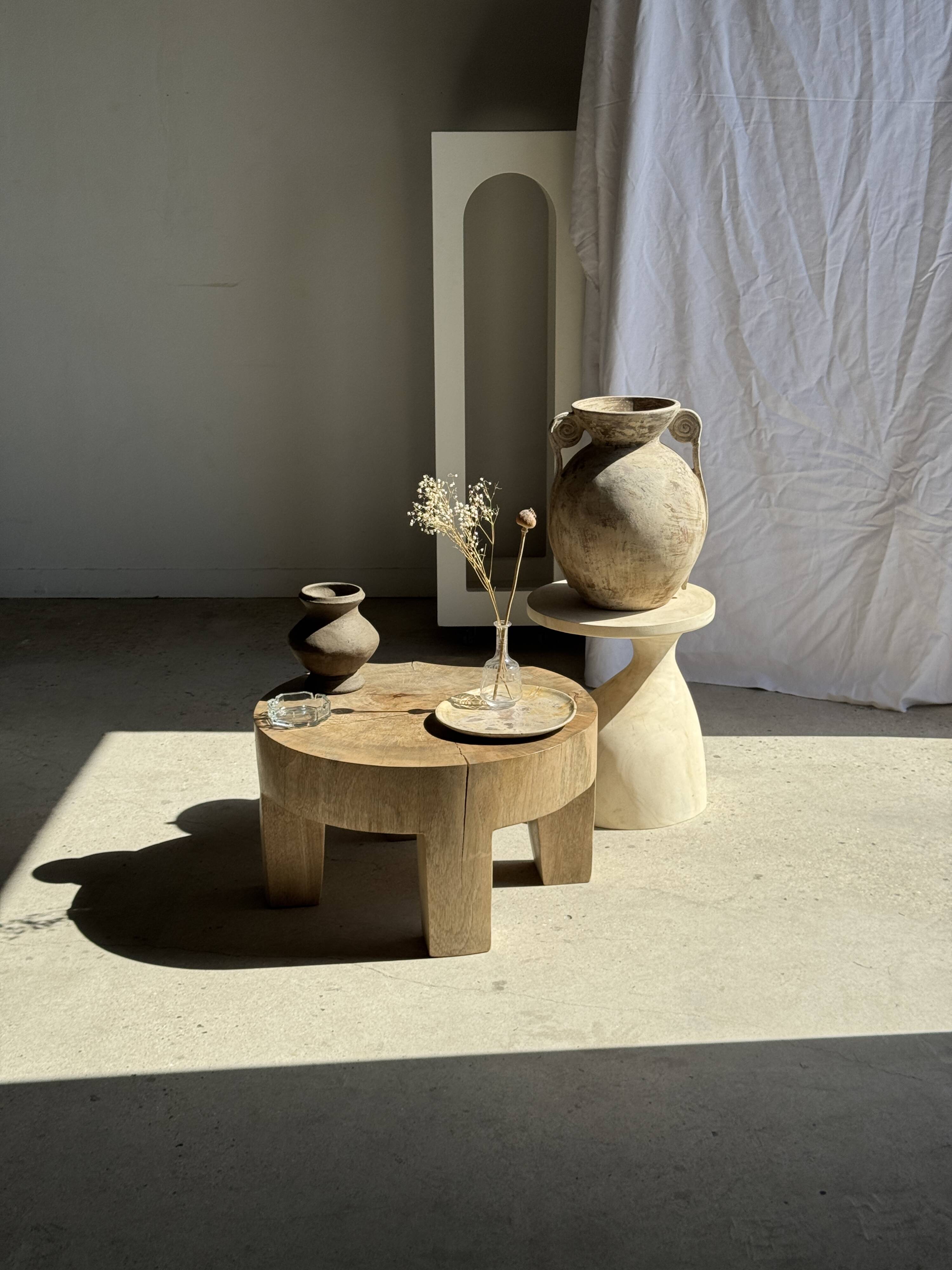 Petrified wood catchall or dish in beige with several grey spots in the centre.