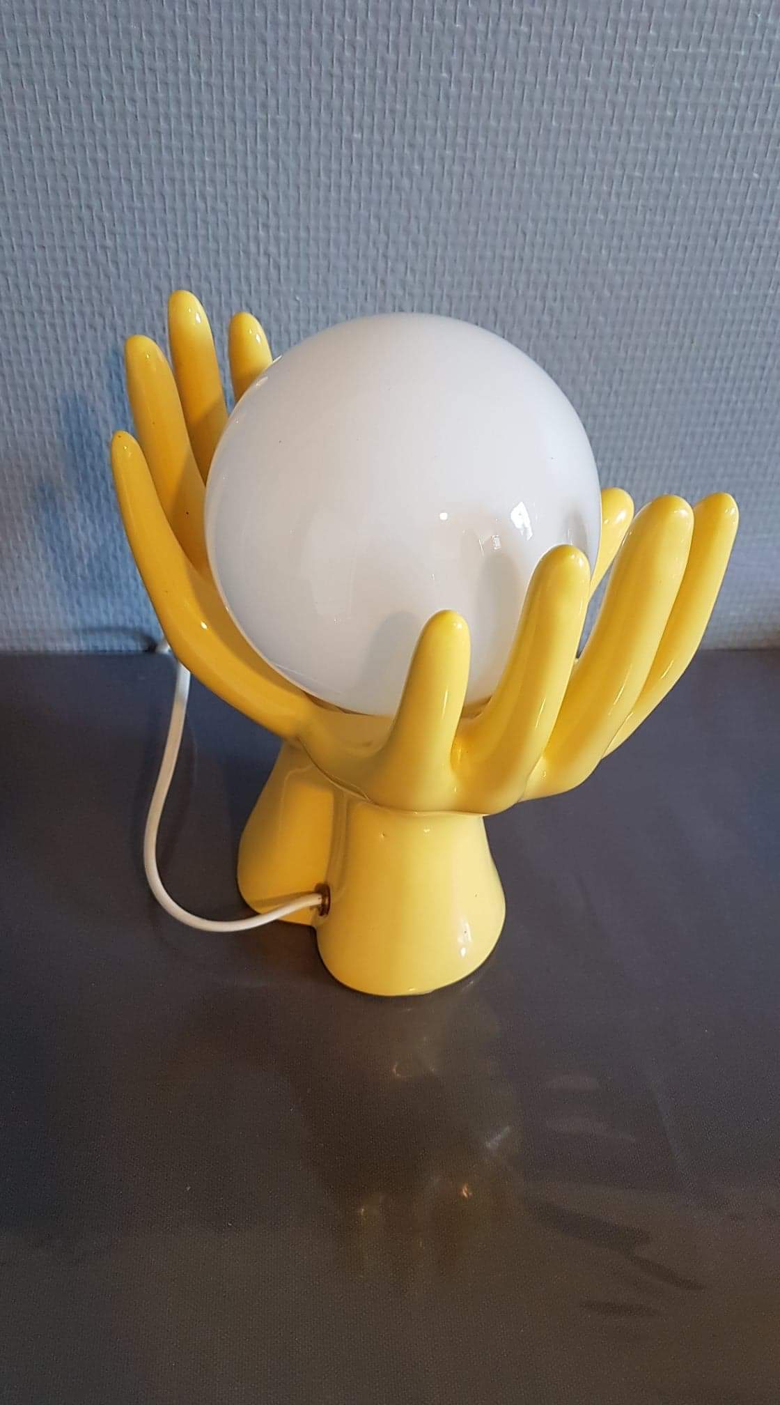 Yellow ceramic hand lamp with white opaline globe