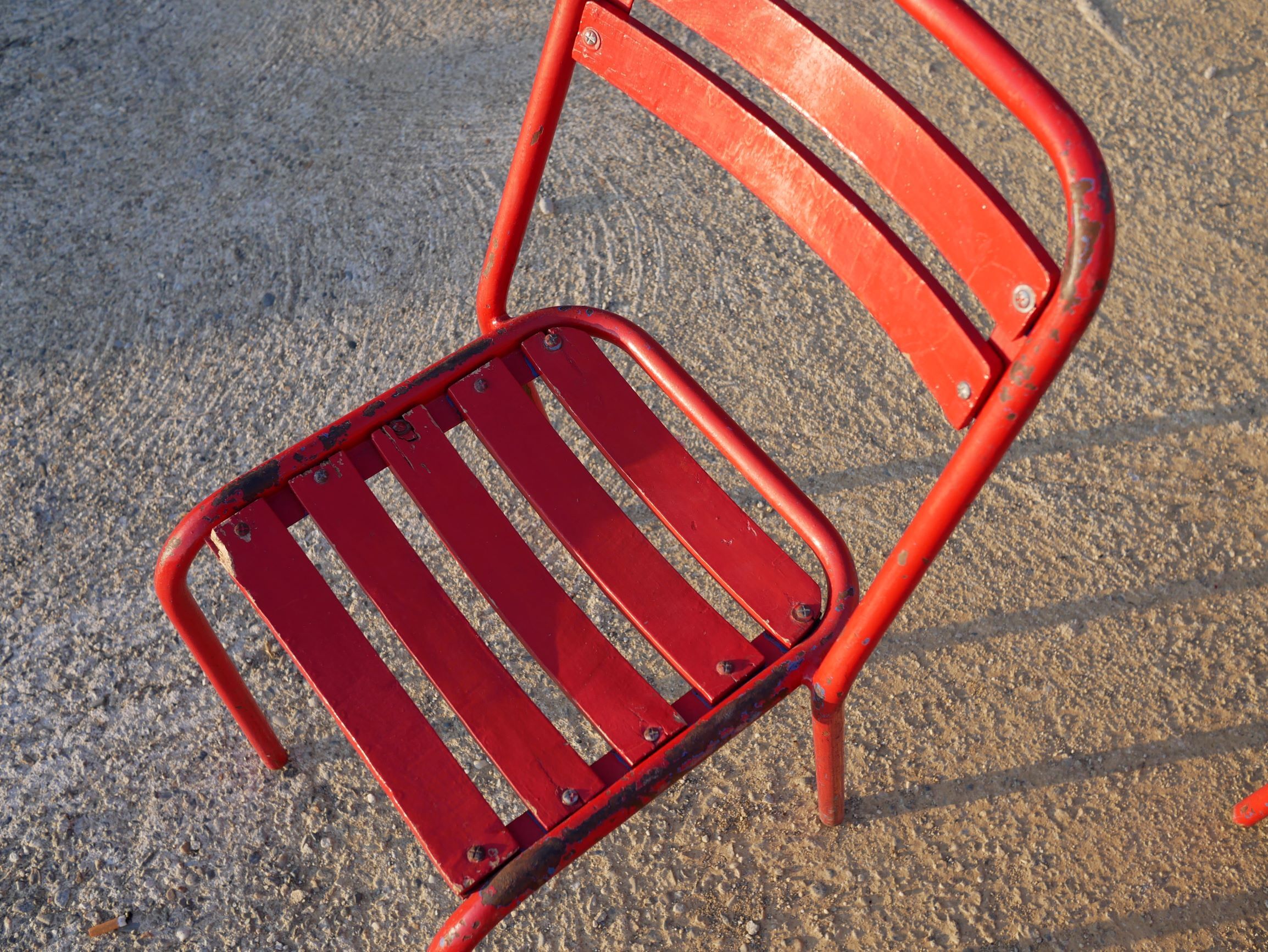 2 chairs Tolix T2 red by Xavier Pauchard