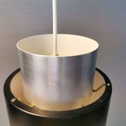 A set of beautiful cylinder shaped hanging lamps in silver color with black "ring" Danish 1970s.