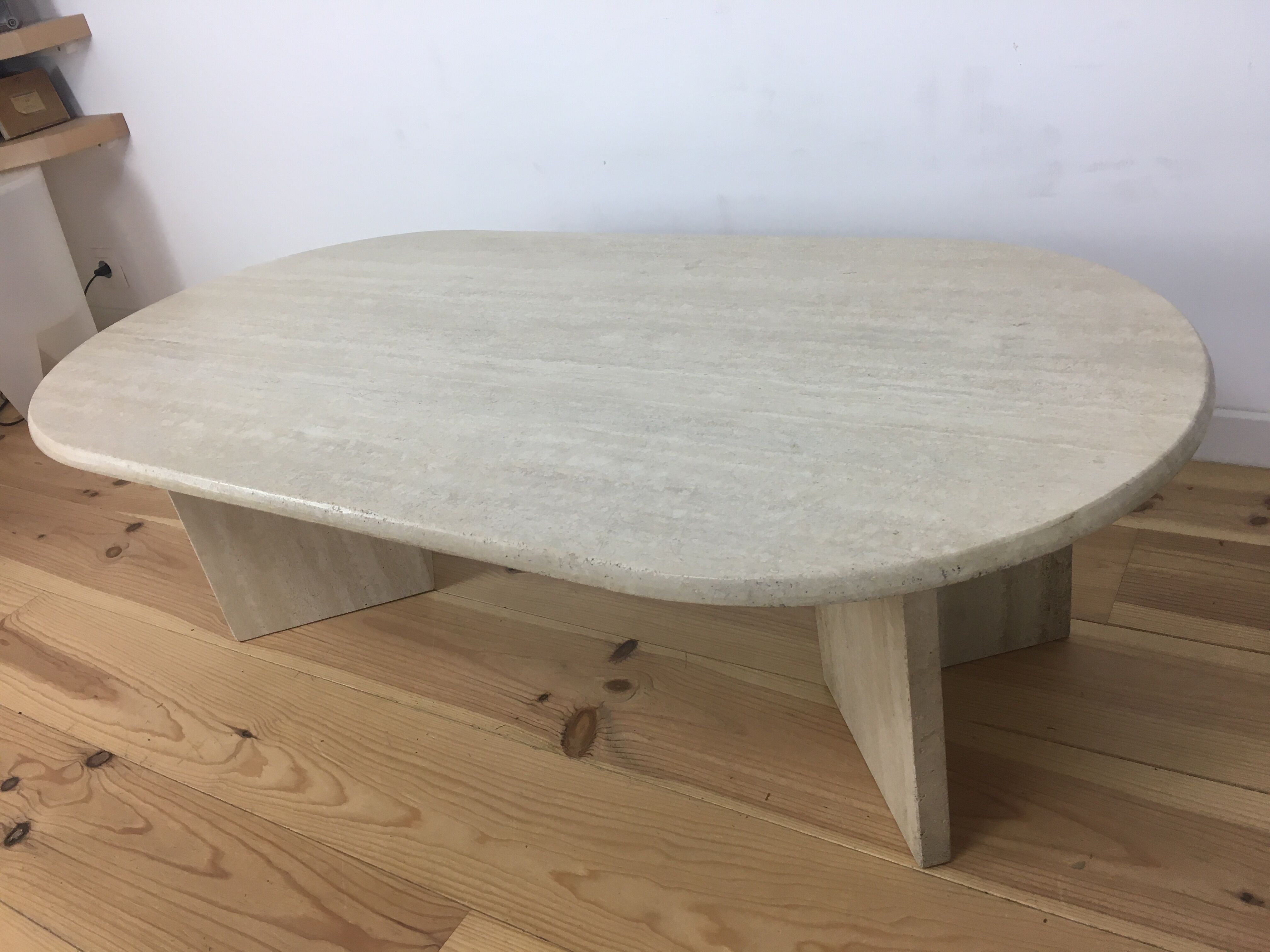 Oval coffee table in travertine