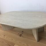 Oval coffee table in travertine