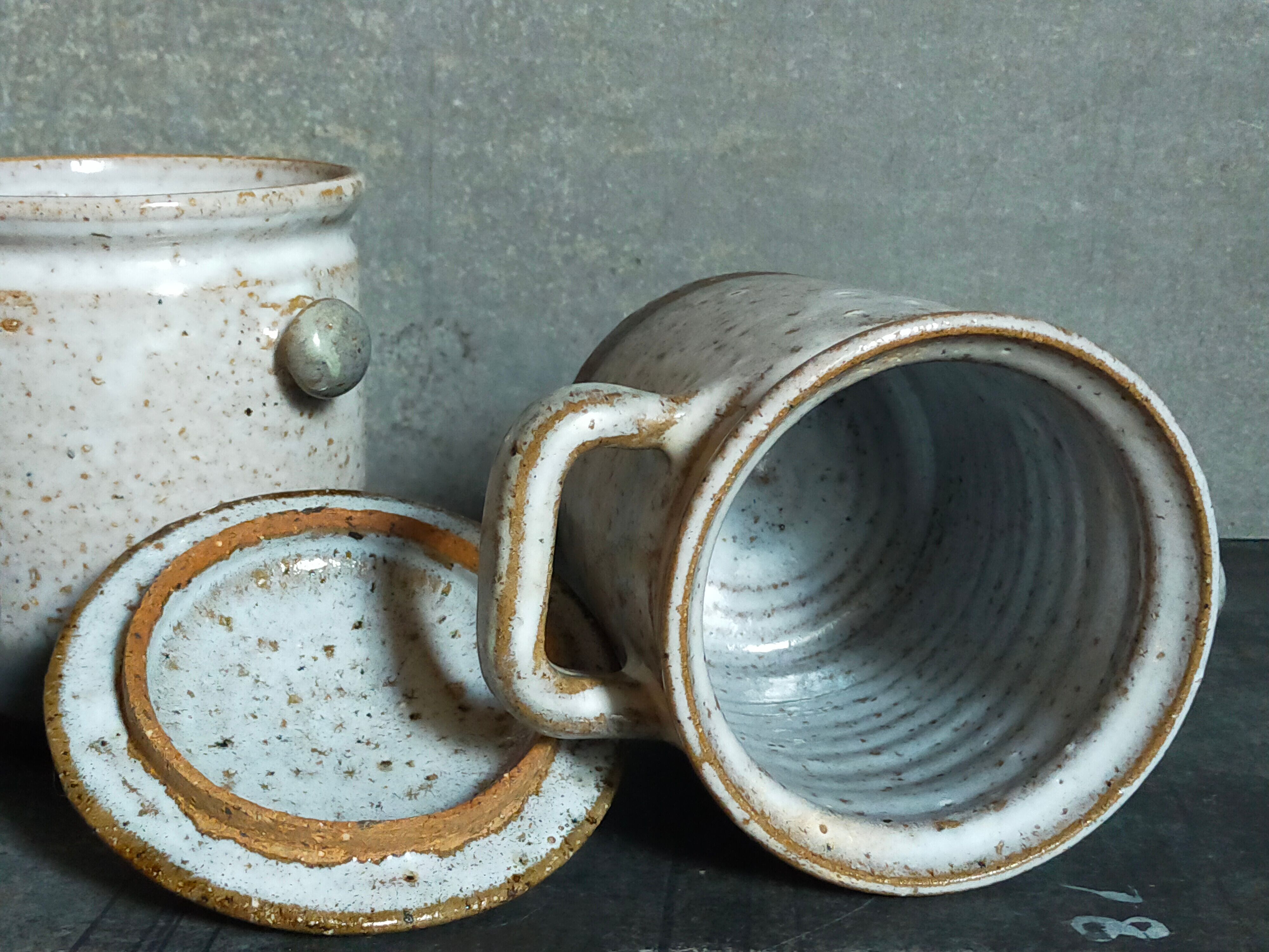 Duo of potter's pots covered in vintage glazed stoneware