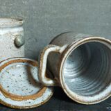 Duo of potter's pots covered in vintage glazed stoneware