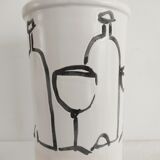 Vase decorated in hollows of bottles and glasses