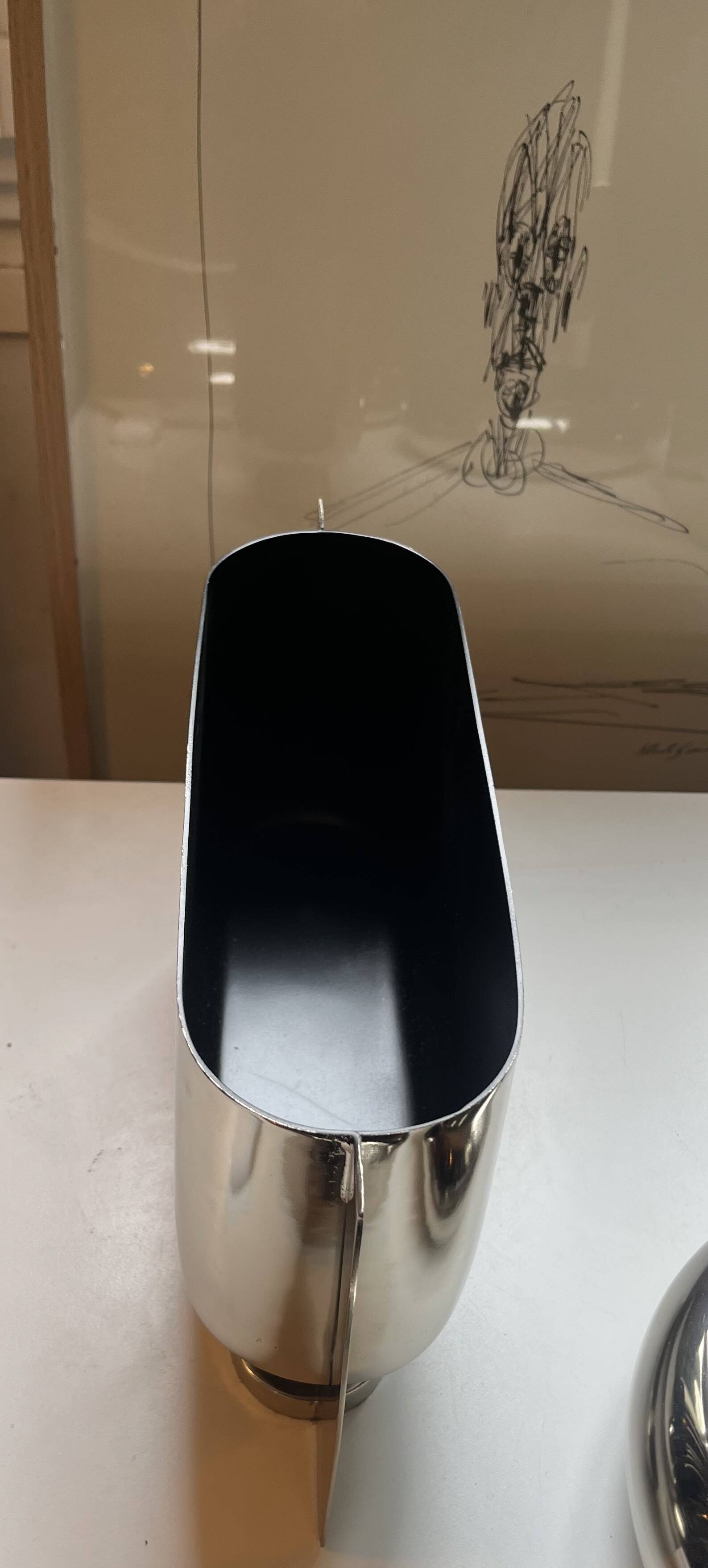 Horizontal vase in silver chrome metal by Jean-Baptiste Fastrez