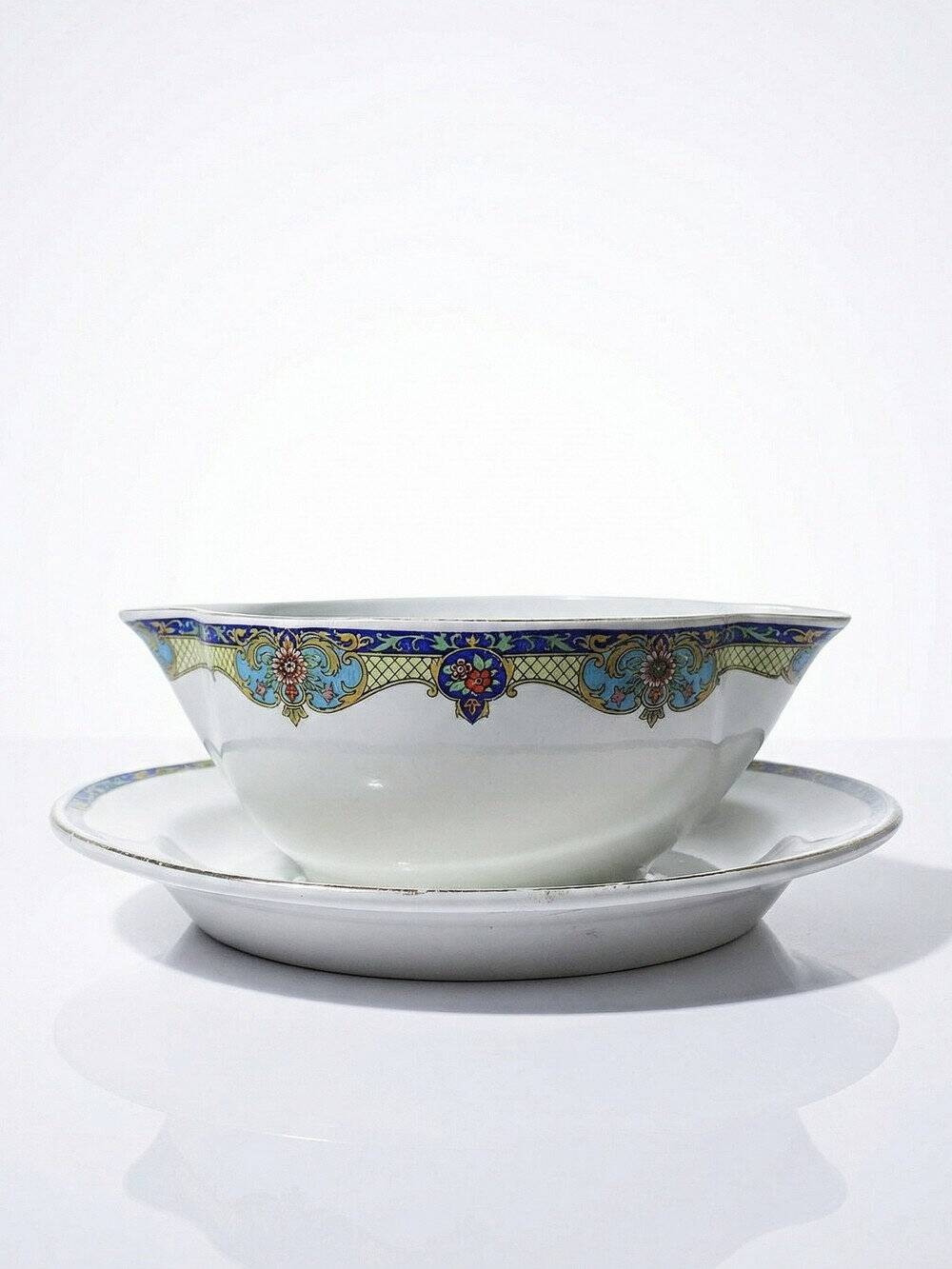 Old Lunéville sauce boat, opaque porcelain with polychrome decoration.