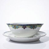 Old Lunéville sauce boat, opaque porcelain with polychrome decoration.