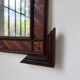 Pair of wooden mirrors in tramp art style