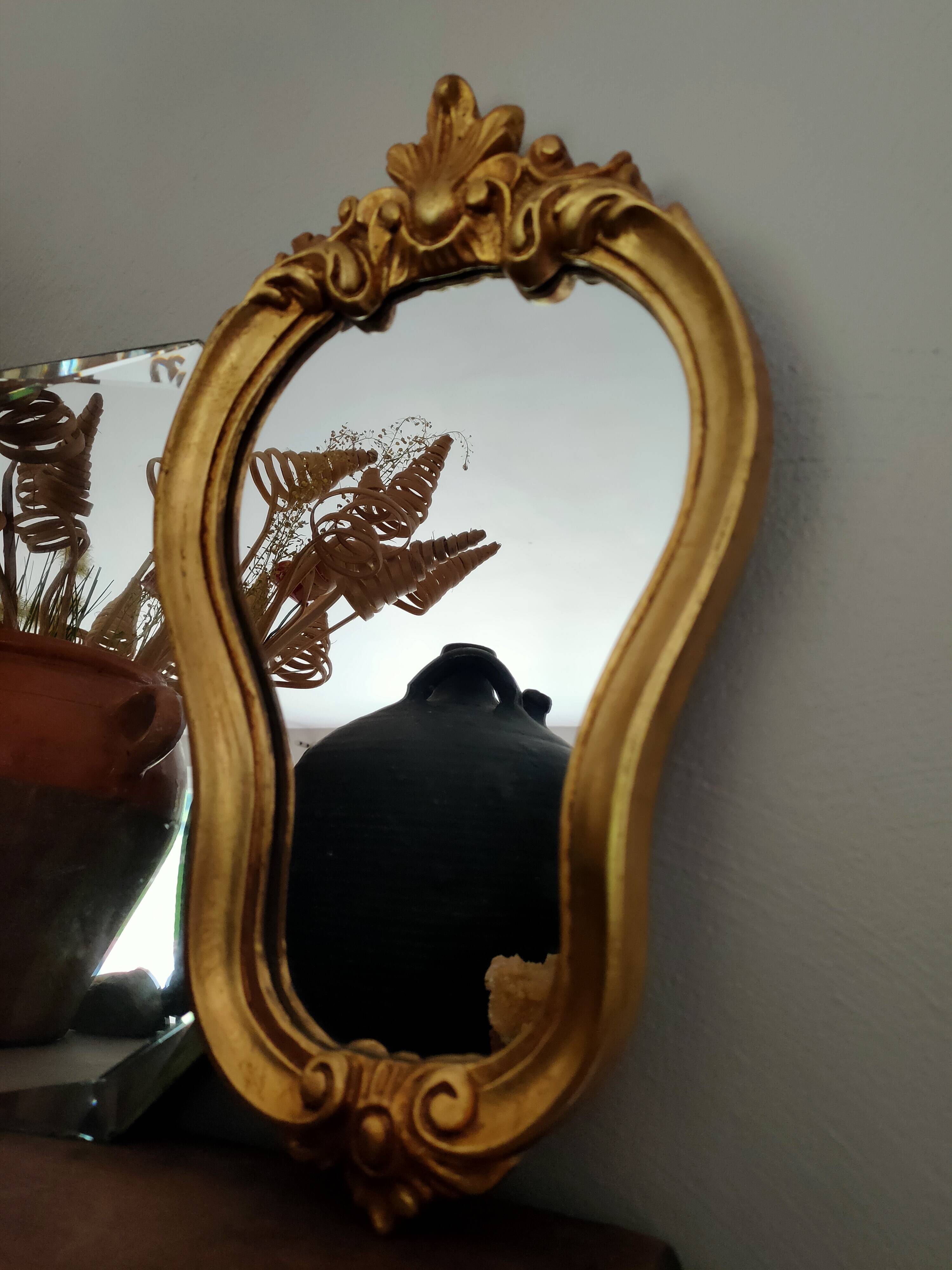 Baroque style gilded mirror.