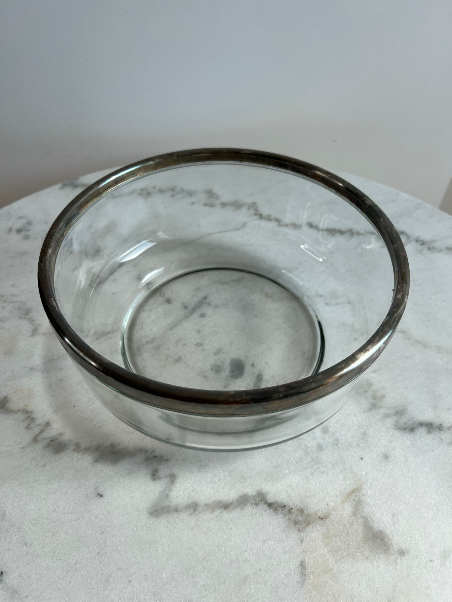 Glass and silver-plated metal salad bowl, silver rim.