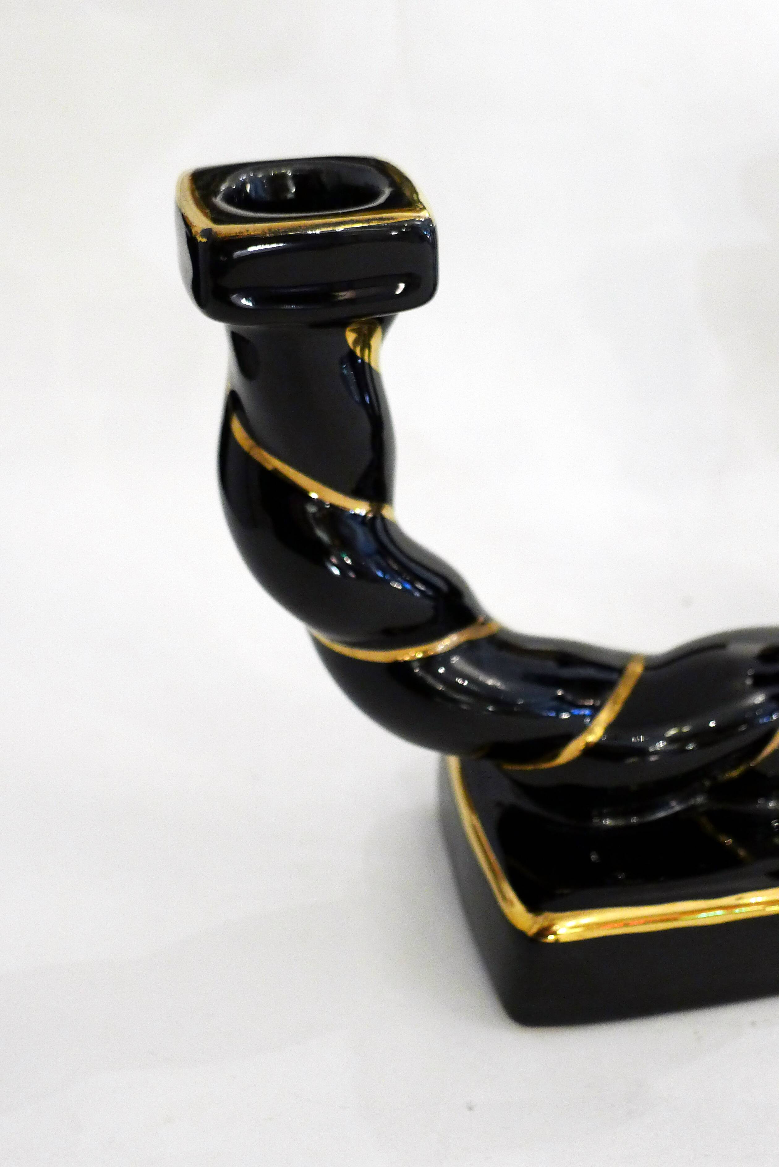 Pair of earthenware braided rope candlesticks