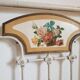 Cast-iron headboard and patinated white wood