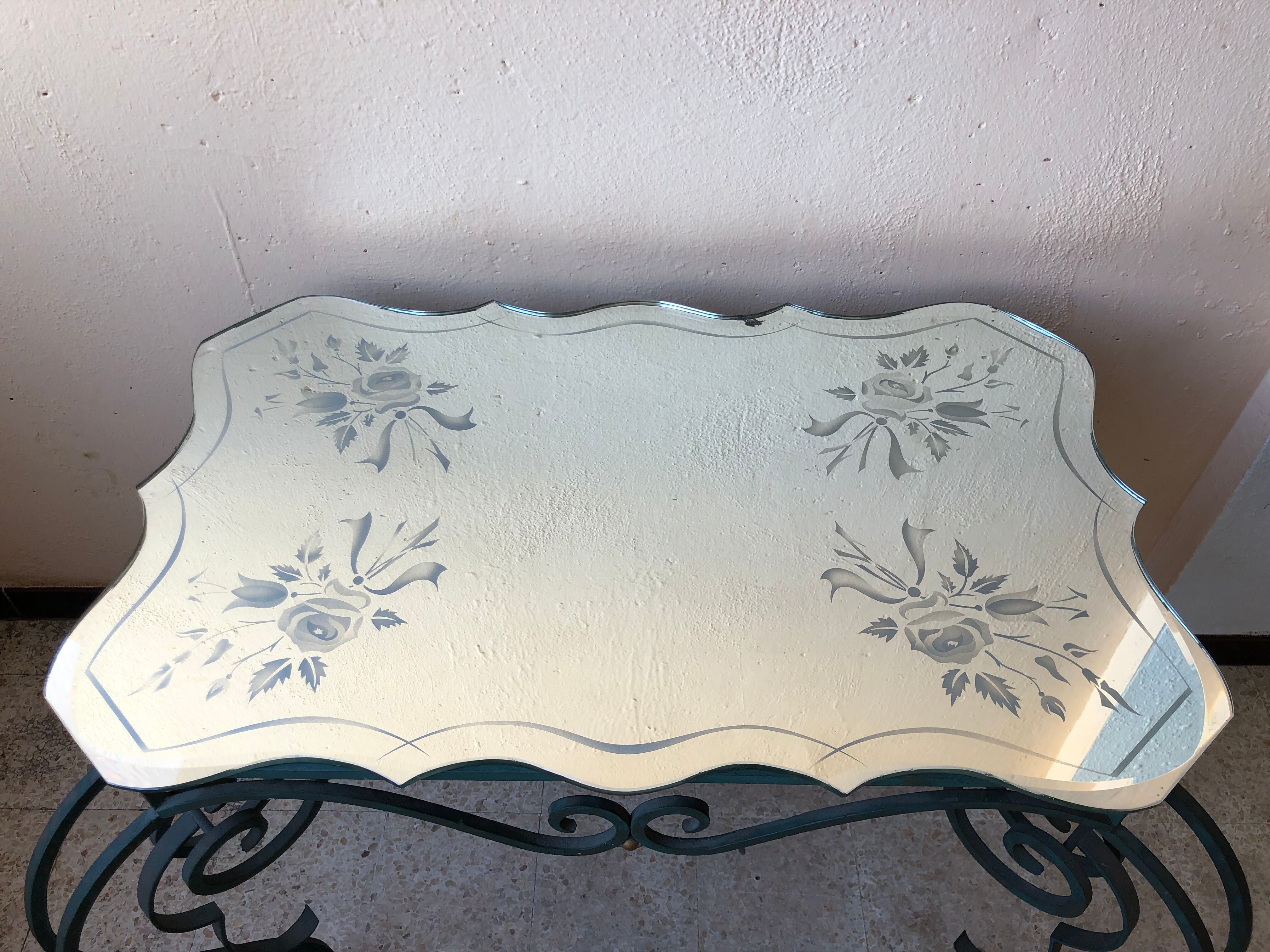 Wrought iron and engraved mirror