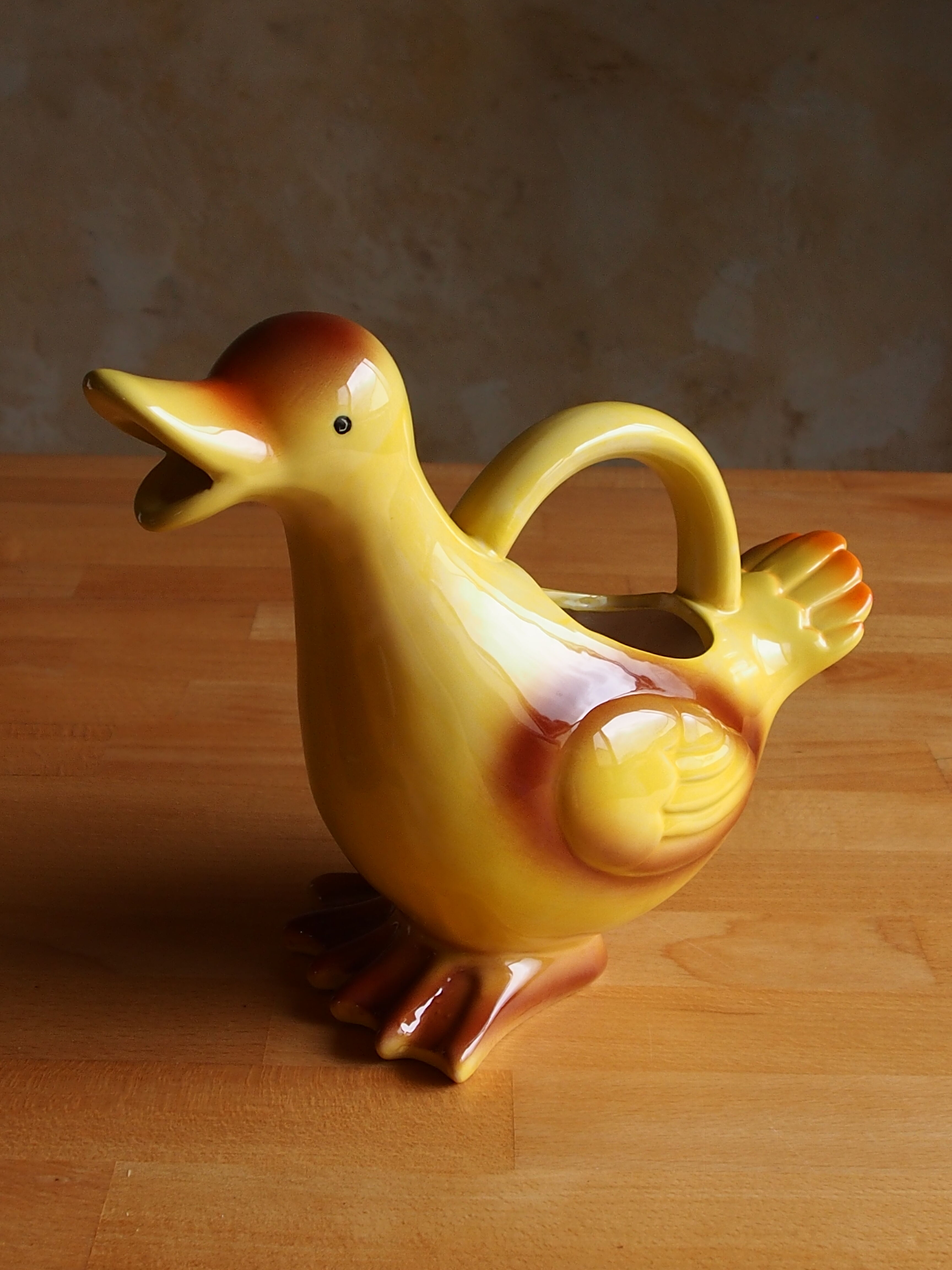 Ceramic watering can in white earthenware, yellow enamel and bird shape