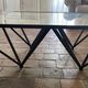 Design coffee table in glass and black metal – Geometric base
