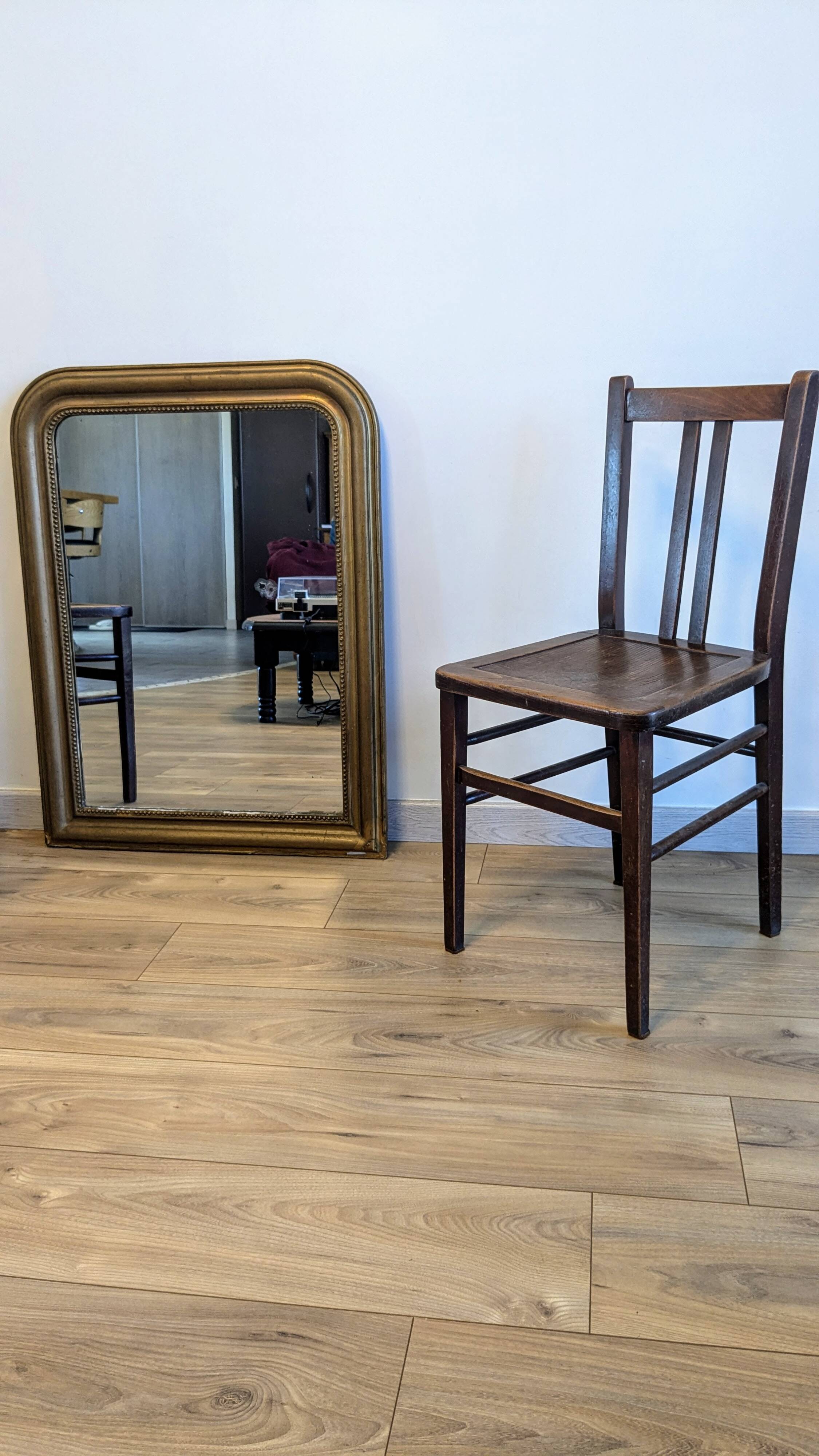 Pair of 1930s bistro chairs with patinated wood.