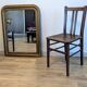 Pair of 1930s bistro chairs with patinated wood.
