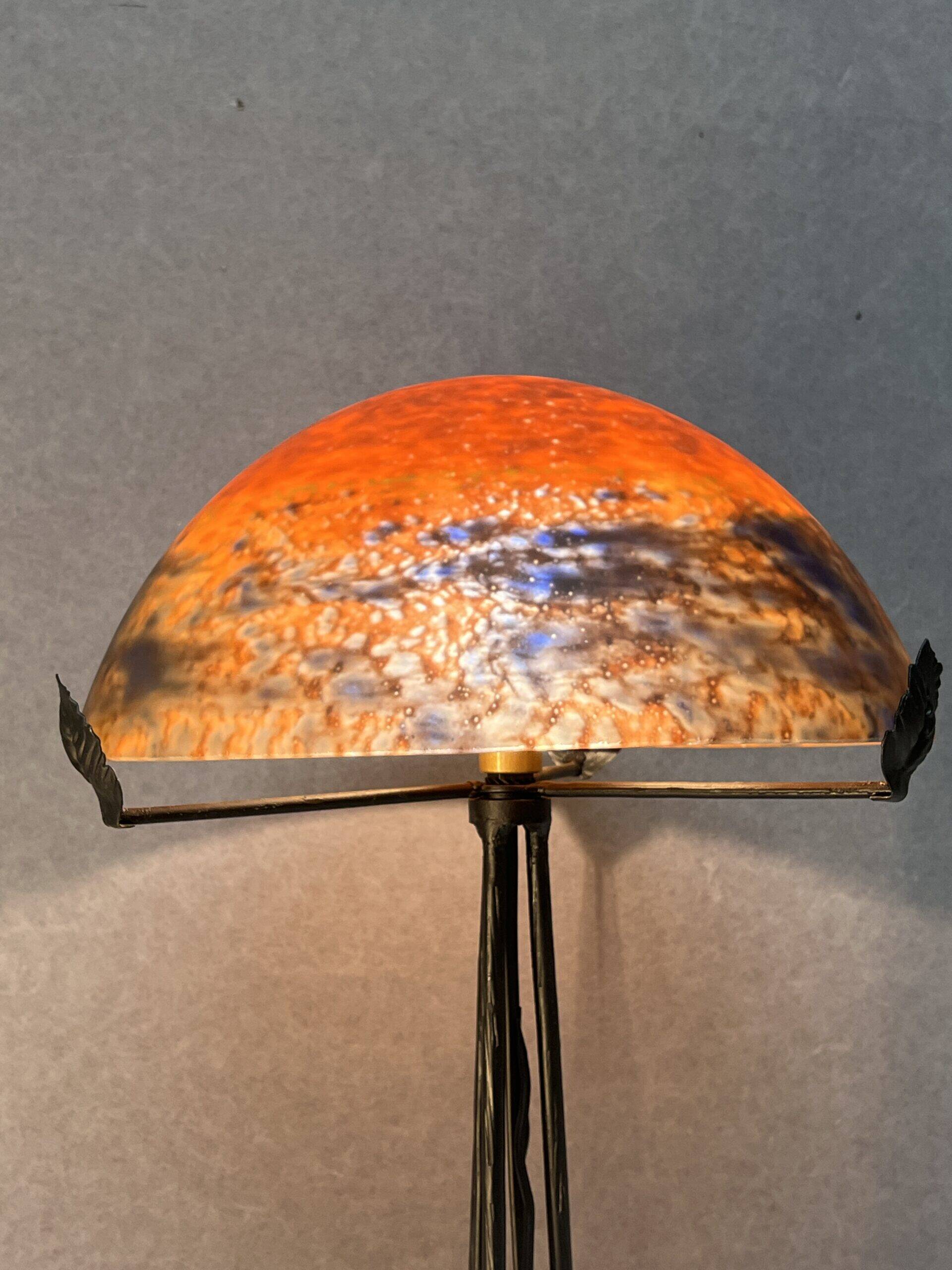 Contemporary mushroom lamp, wrought iron base and shaded orange glass shell
