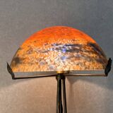 Contemporary mushroom lamp, wrought iron base and shaded orange glass shell