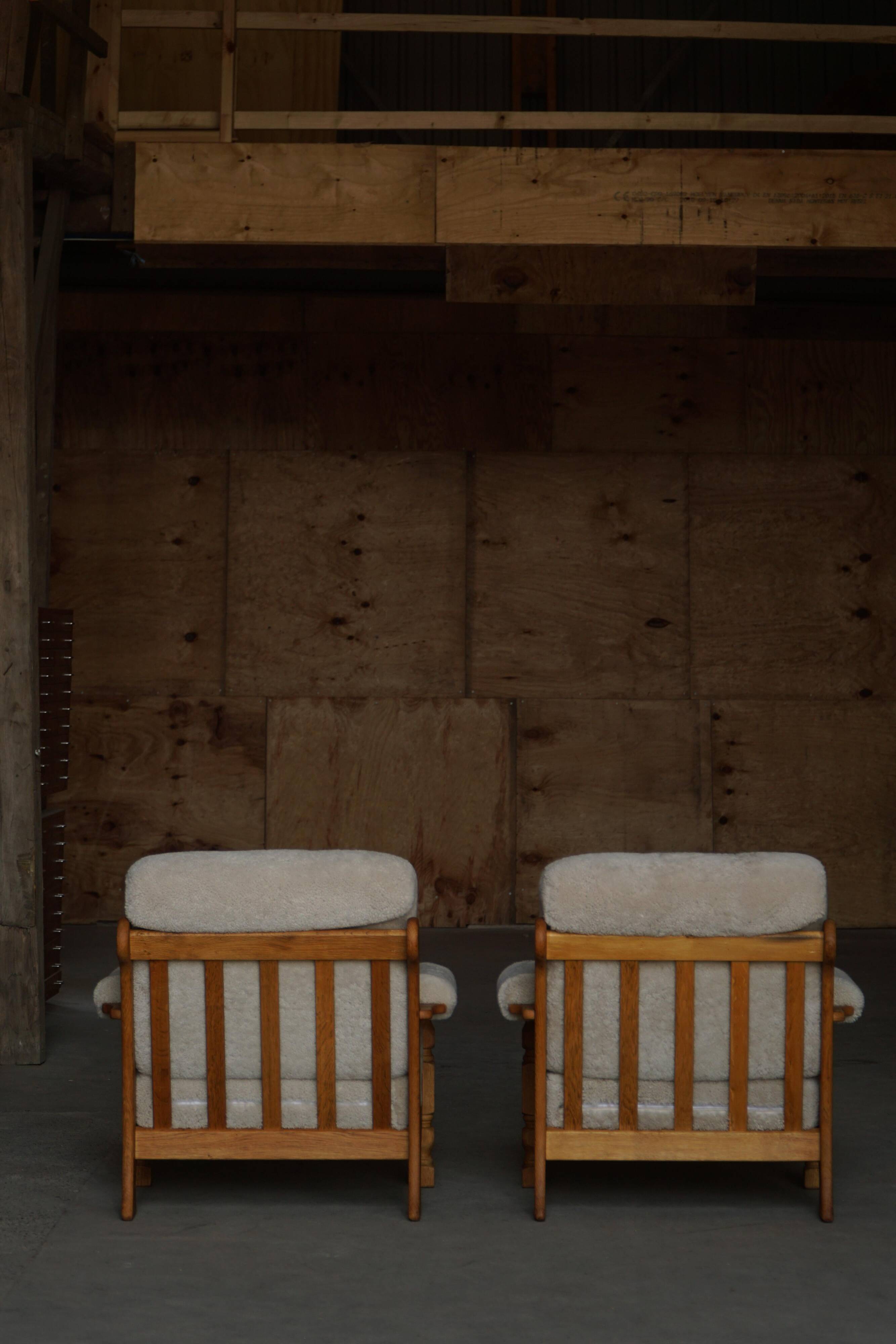 Henning Kjærnulf, lounge chairs in oak and lambswool, mid-century Danish, 1960s.