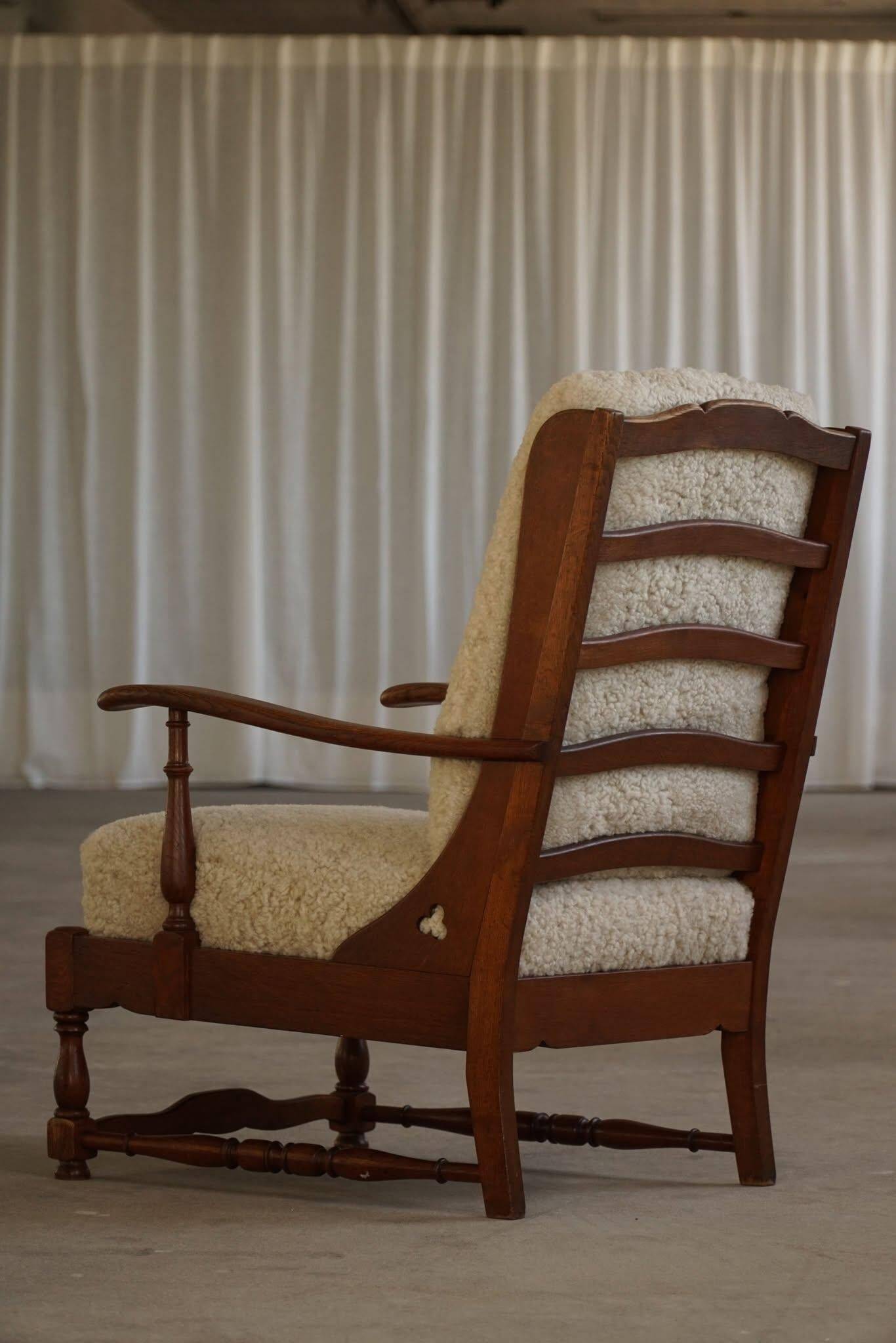 Modern Danish design, a pair of high-backed armchairs in oak and lambswool, 1950s.