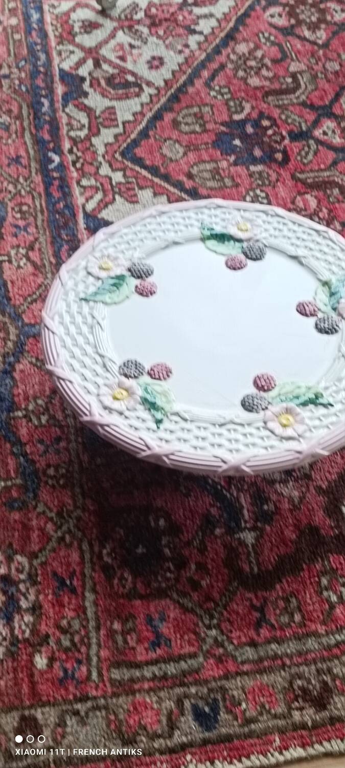 Footed dessert plate in barbotine porcelain, marked FG.