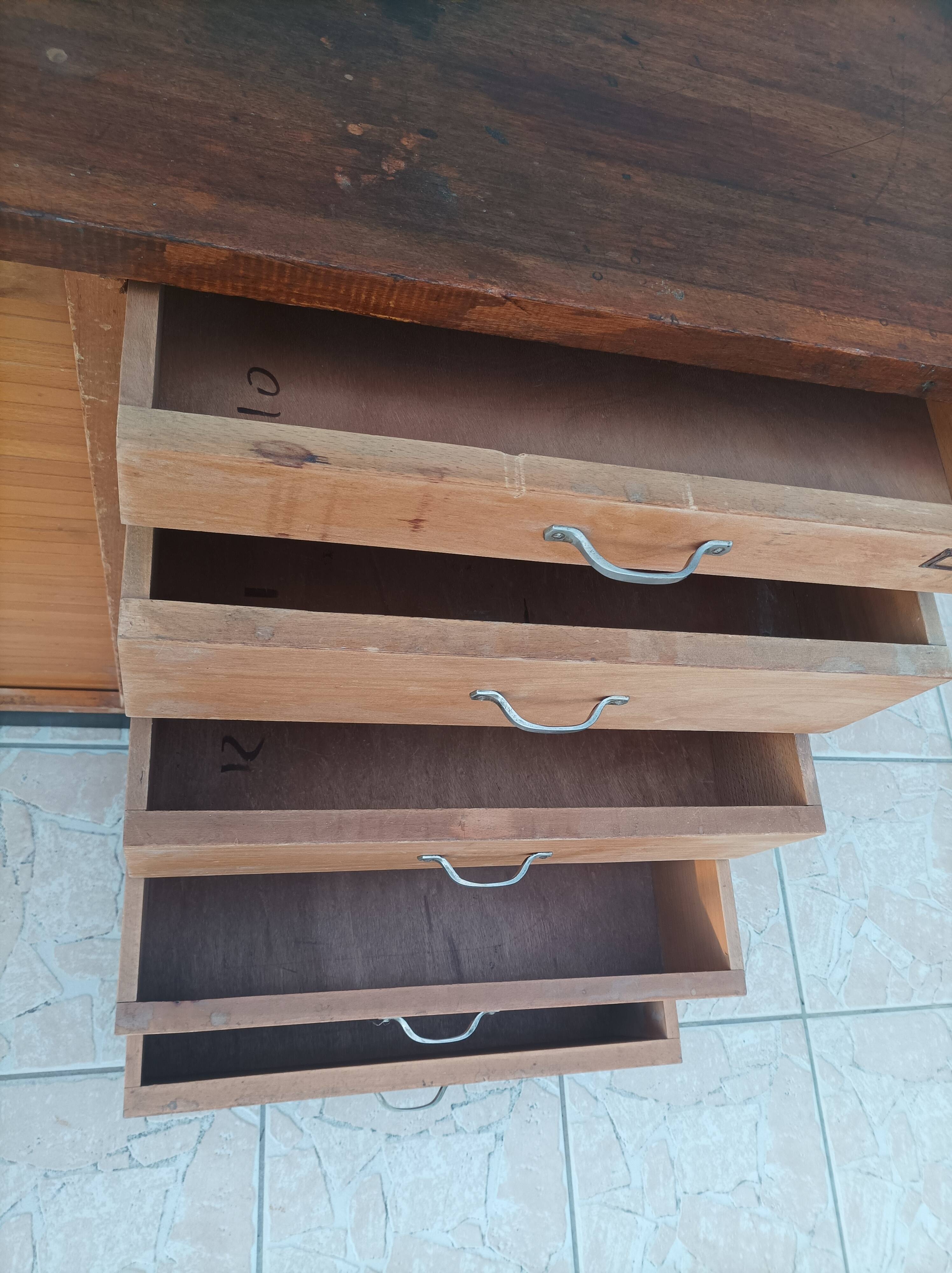 Workshop furniture with drawers and curtain in beech and walnut.