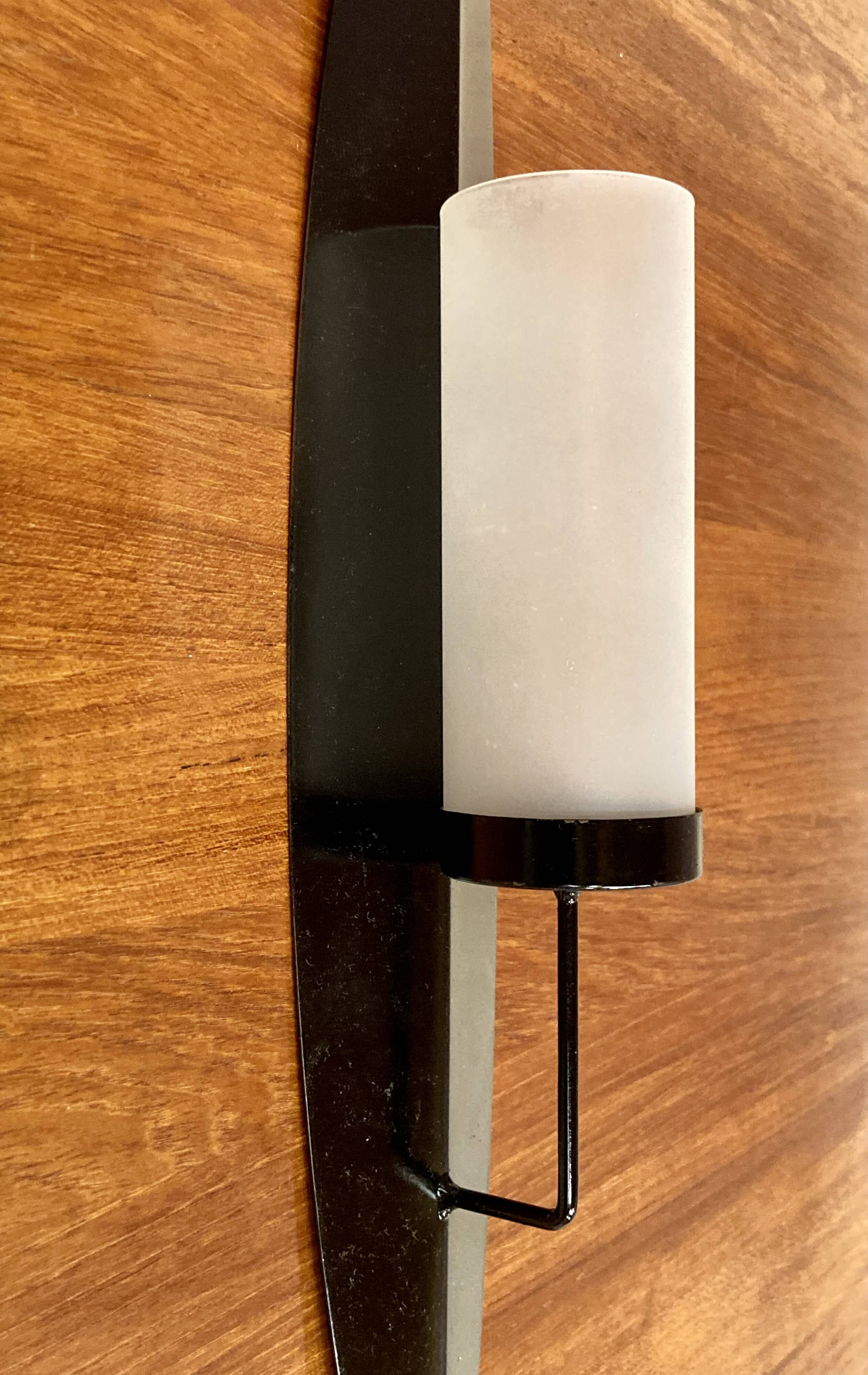 PAIR OF SCANDINAVIAN DESIGN METAL AND GLASS CANDLE HOLDERS.