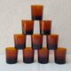 11 amber-coloured glasses