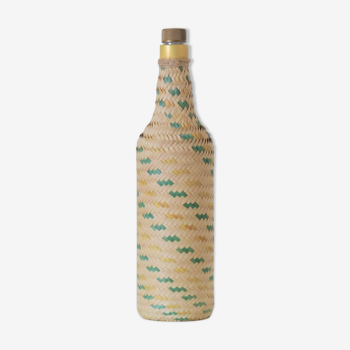 Glass and wicker bottle