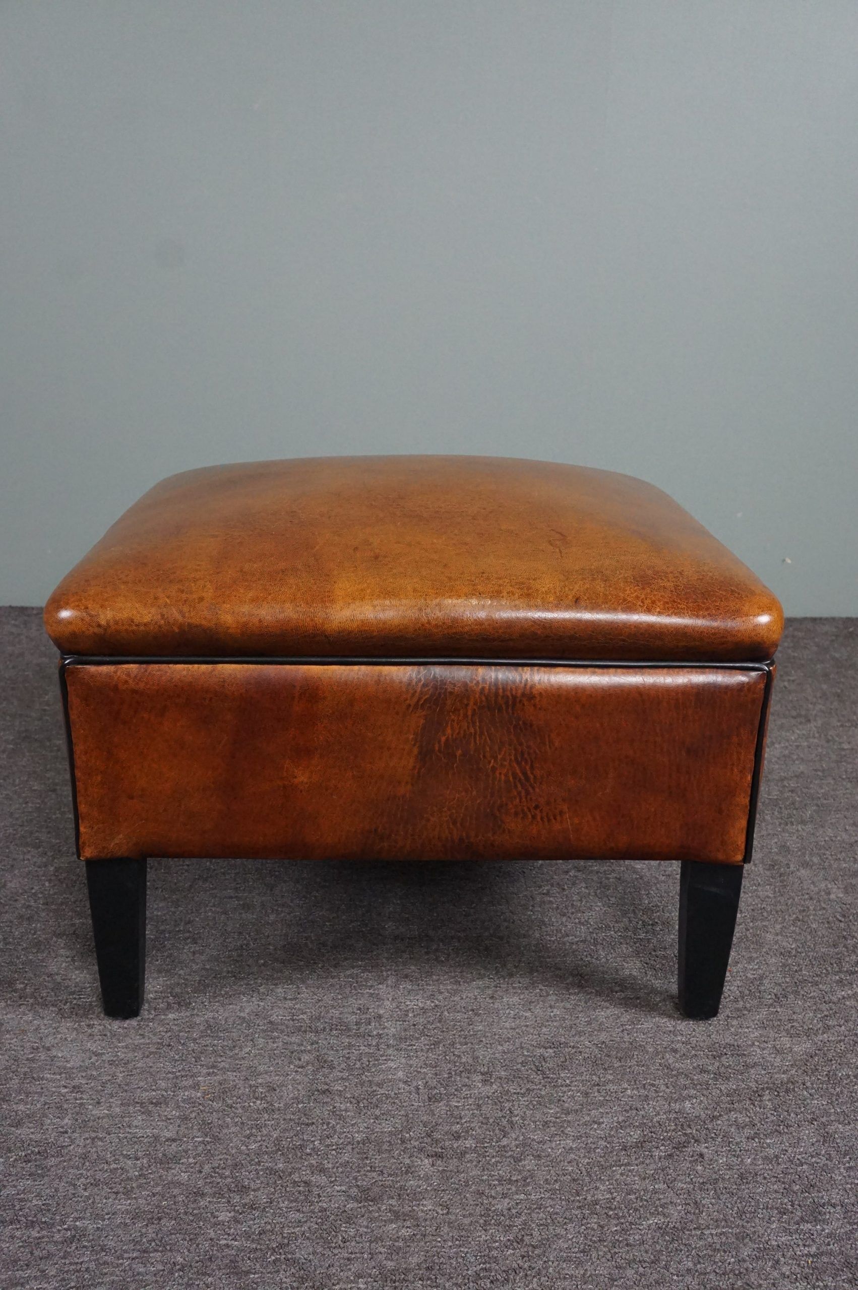 Schapenleren armchair and studio lounge stool