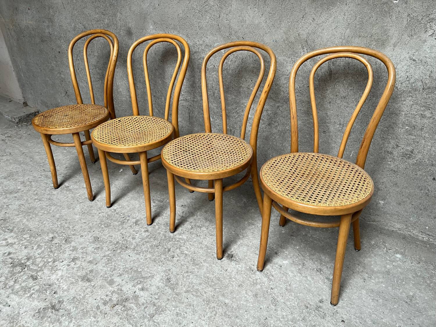 Set of 4 vintage bistro chairs in curved wood and cane seats 1950 1960