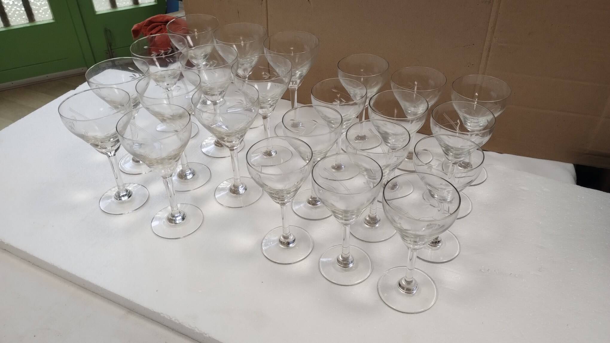 set of 23 champagne glasses or wine glasses in chiseled crystal.