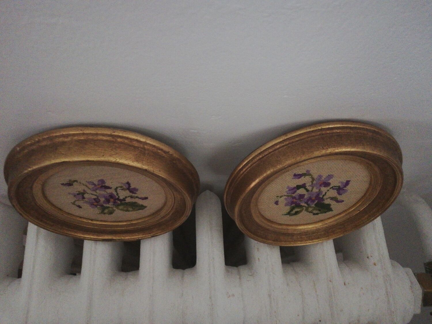 Pair of miniature gold round frames