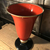 Cut vase on foot in red and black metal