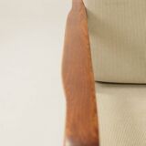 Vintage armchair in olive corduroy with a wooden frame.