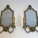 Pair of mirror and bronze wall lamps with lions' heads, french work. around 1940