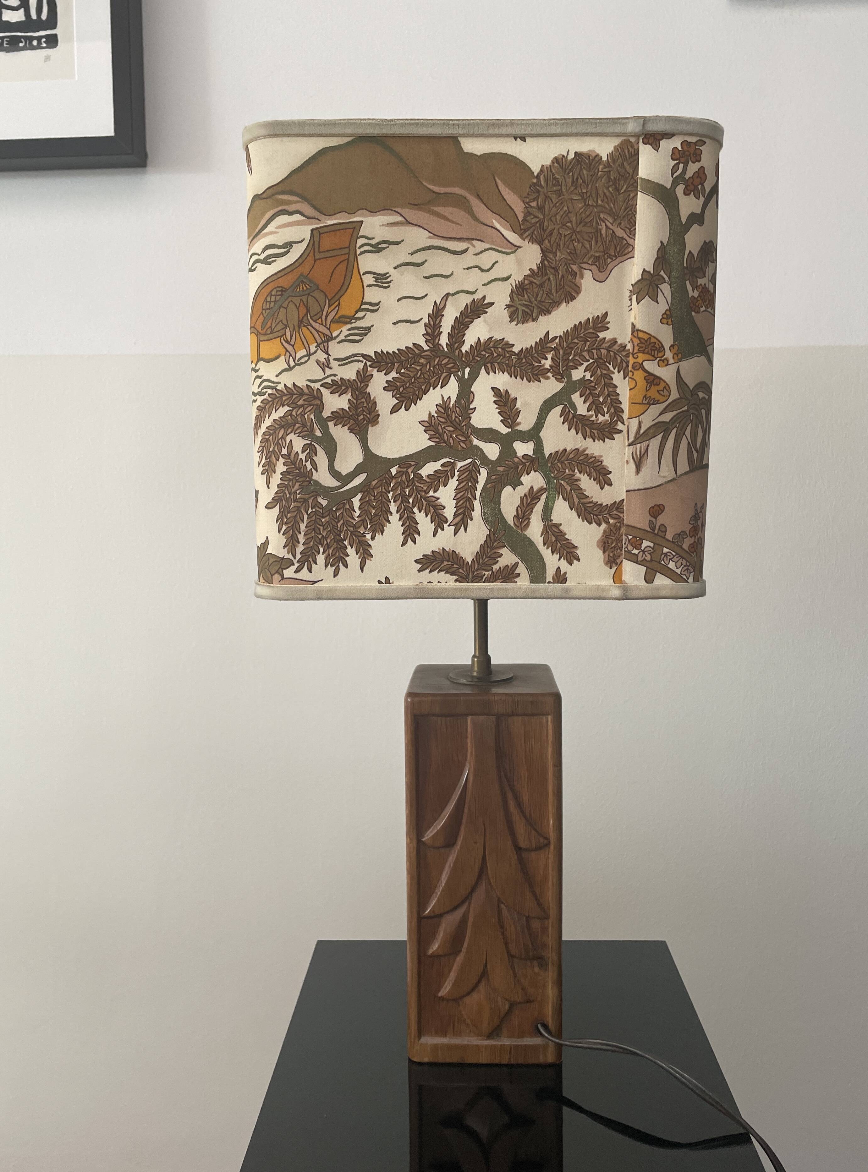 Wooden lamp with carved plant decoration from 1930-50, sold with a 1970 lampshade.