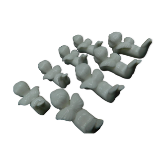 8 porcelain knife rests - Cherubs