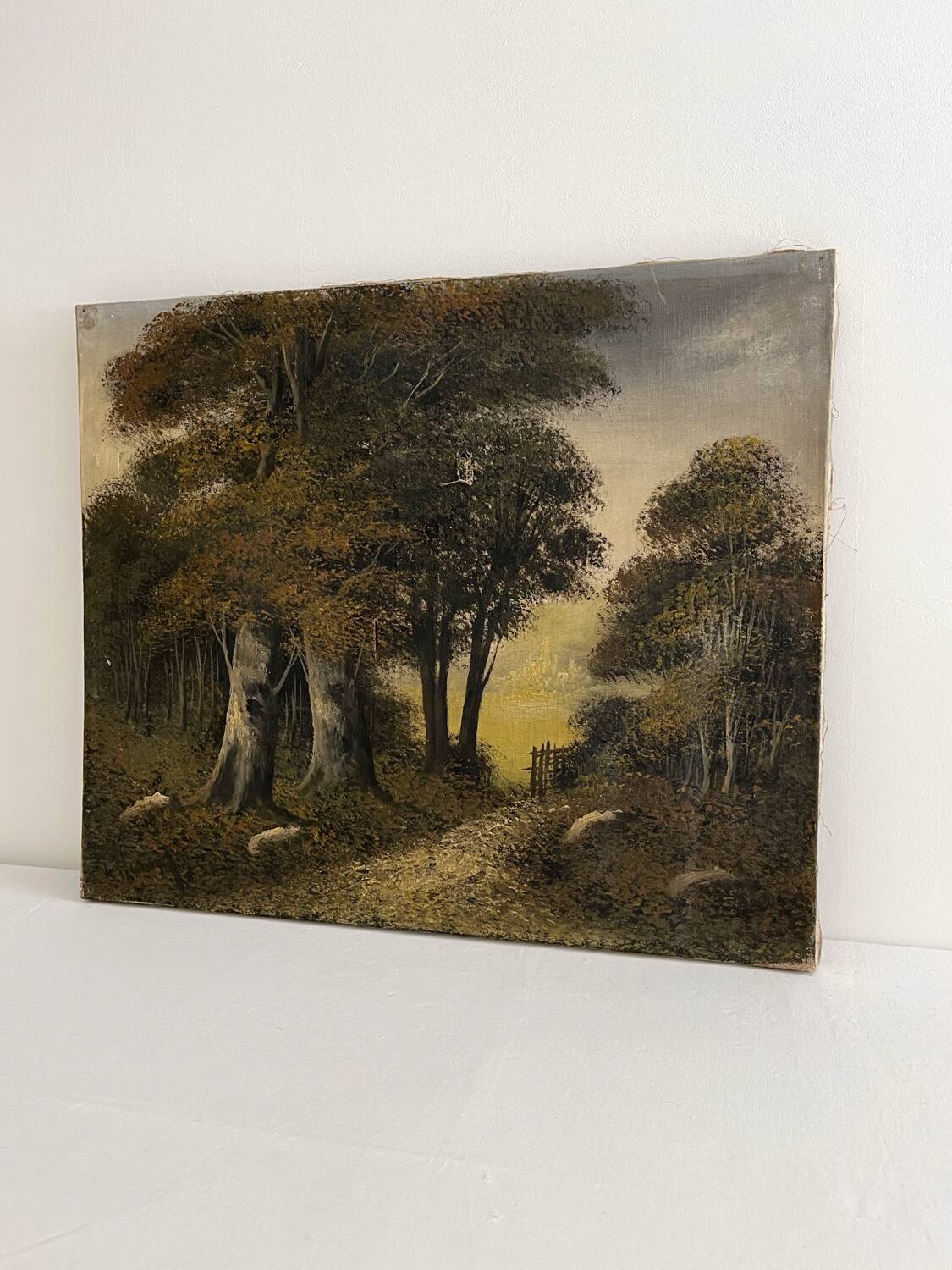 Old oil painting on canvas of a forest landscape.