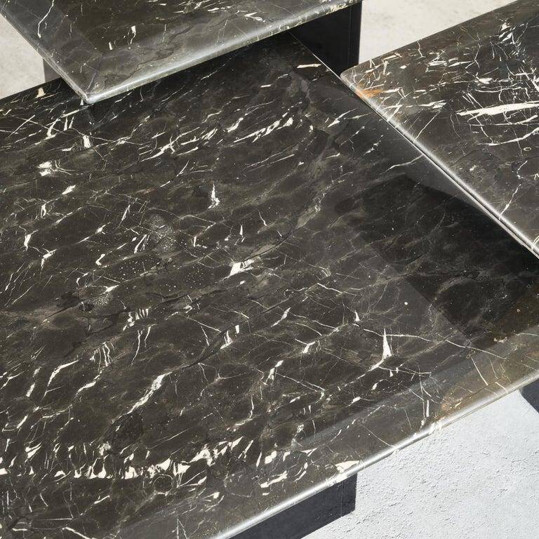 Set of 3 marble and lacquer coffee tables, 1970s.