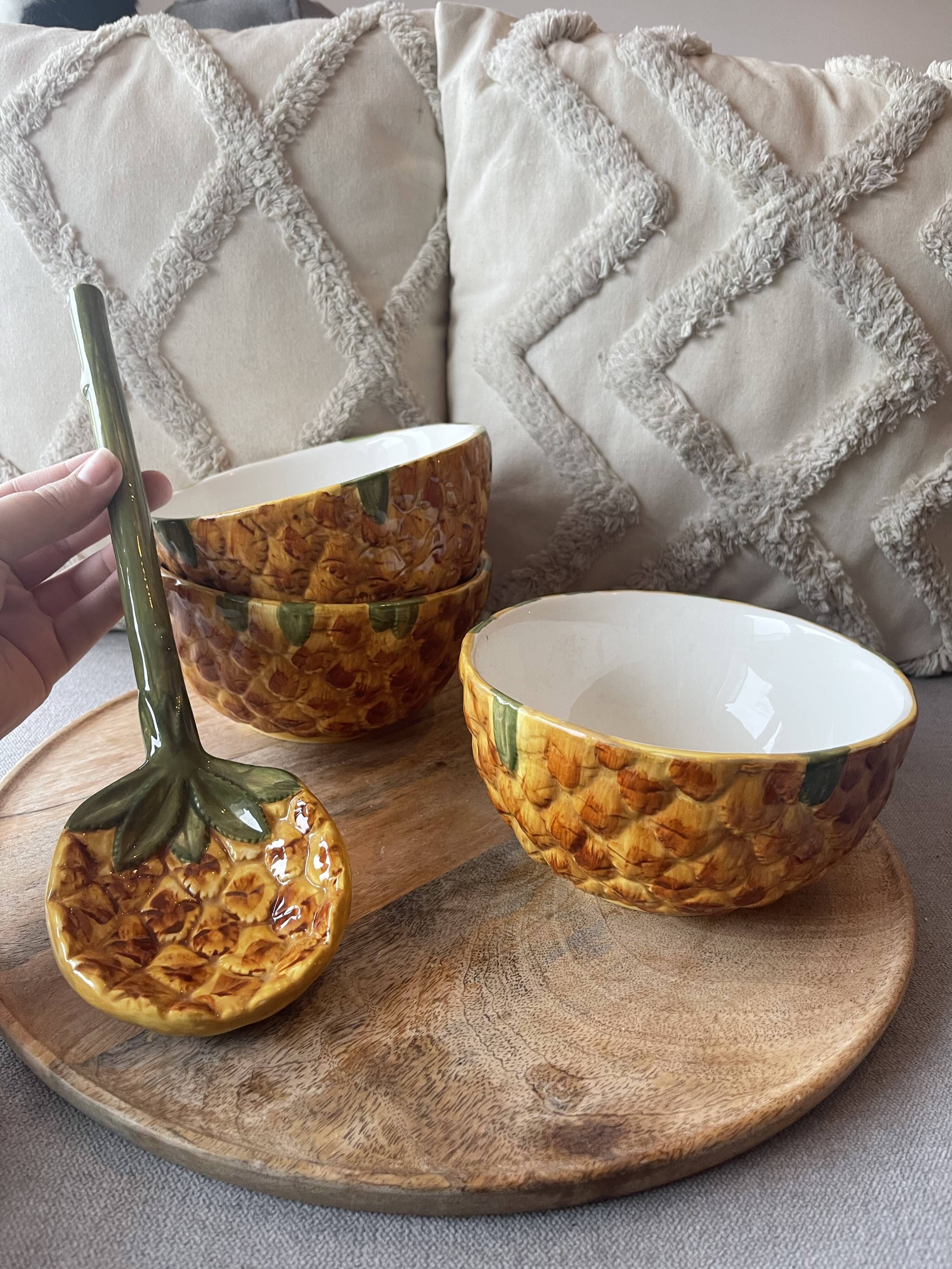 Old set of bowls and spoons in the shape of vintage pineapple