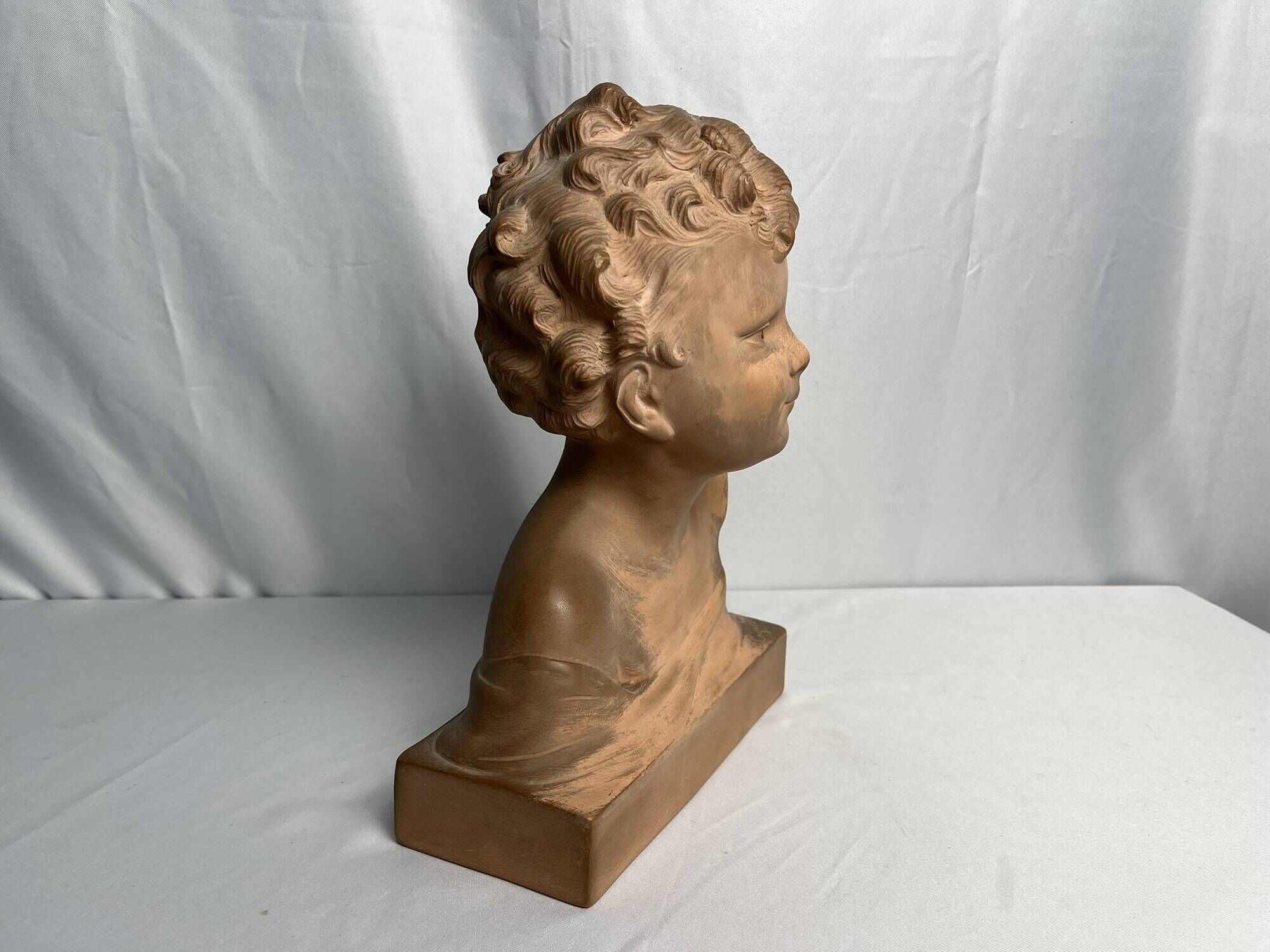 Cipriani, child bust in terracotta art signed 20th century