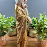 Statue of the Virgin holding the Child Jesus in polychrome terracotta.